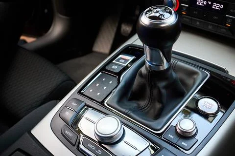 Modern luxury interior engine start stop button shift gear of manual gearbox and Stock Photos
