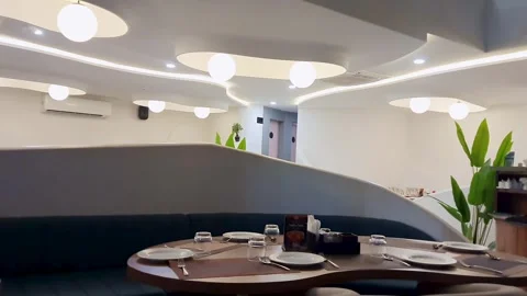 Modern luxury restaurant interior with elegant dining table and ambient Stock Footage 335008967