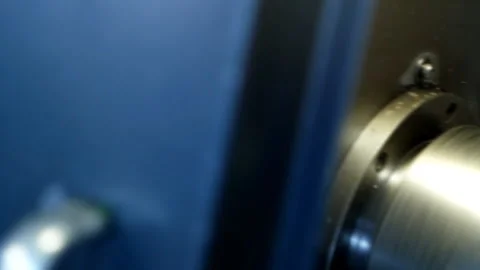 Modern machine computer numerical control grinds metal part in factory Stockbeeldmateriaal 103795881