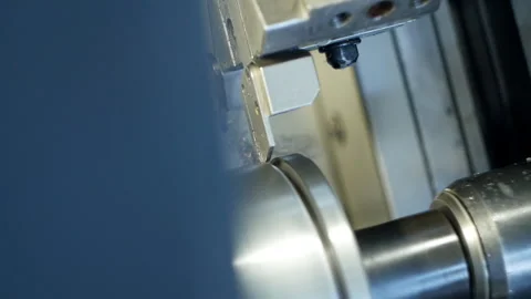 Modern machine computer numerical control grinds metal part in factory Stockbeeldmateriaal 104151846