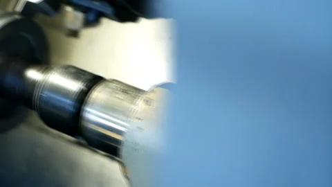 Modern machine computer numerical control grinds metal part in factory Stockbeeldmateriaal 104428946