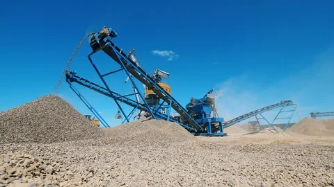 Modern machine crushes rubble at a quarry. Mining industry equipment. Stock Footage 111701796