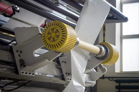 Modern machine for cutting large rolls of white paper for printing houses with Stock Photos
