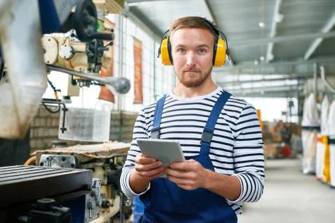 Modern Machine Operator Working at Plant Stock Photos