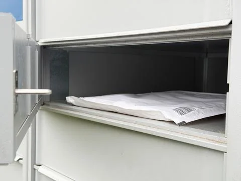 Modern mailbox system receiving online shopping parcel. Stock Photos