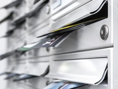 Modern mailboxes filled of leaflets Stock Photos