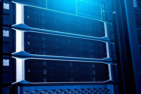 Modern mainframe storage in data center close up under neon blue toning Stock Photos