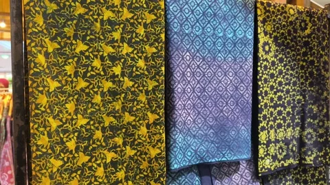 Modern Malaysian Batik Using Terap and Canting Techniques on Mannequin Stock Footage 323782511