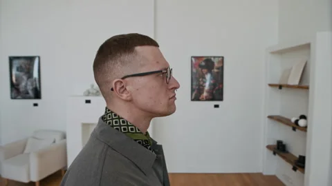 Modern Man with Nose Piercing in Art Gallery Stock Footage 310280661