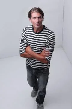 Modern man standing in the corner of the white room . 스톡 사진