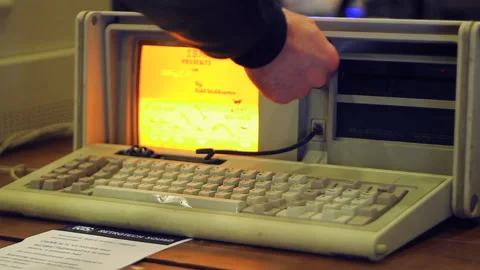 Modern Man Trying To Remember How Does Old Ugly Designed Computer Works Stock Footage 93321696
