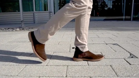 Modern man walking in slow motion, close up Stock Footage 96065251