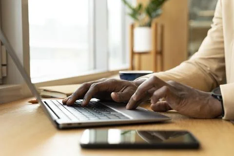 Modern man working in a caffe Stock Photos