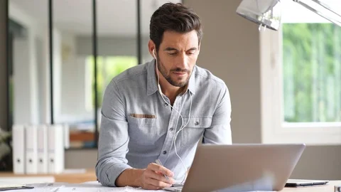 Modern man working in office Stock Footage 116083492