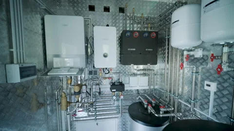Modern mechanical room interior showing a complex HVAC system with heat pump Stock Footage 340112957