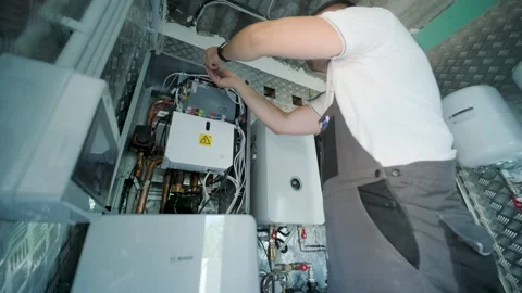Modern mechanical room interior showing a complex HVAC system with heat pump Stock Footage 340113102