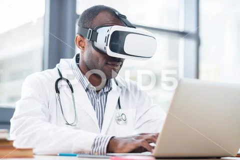 Modern medical worker doing experiment Stock Photos