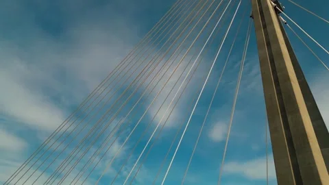 Modern metal cable bridge on blue sky background at sunset, contemporary Stock Footage 276876475