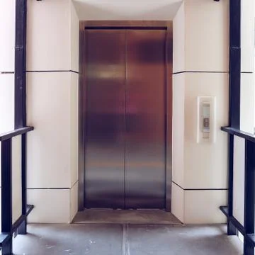 Modern metal elevator close door in building office 写真素材