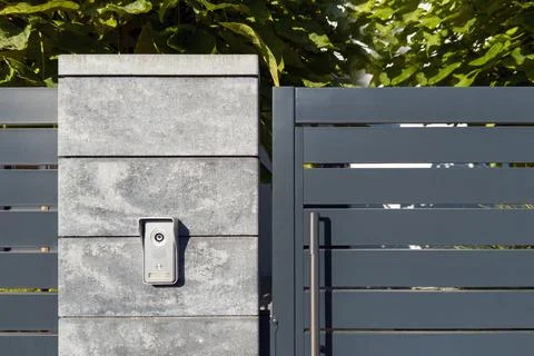 Modern Metal Gate with Intercom on Concrete Pillar Stock Photos