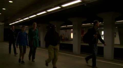 Modern metro station at platform, people in transit and commuting to work Stock Footage 42491153