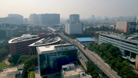 Modern metro train traveling on elevated tracks through the busy city of Hy.. Stock Footage 327946675
