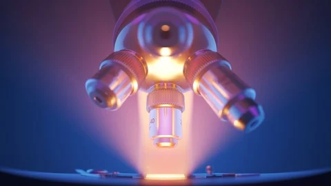 "Modern microscope changing lenses in a laboratory. Light rays in the fog. 4KHD" 스톡 동영상 98950988