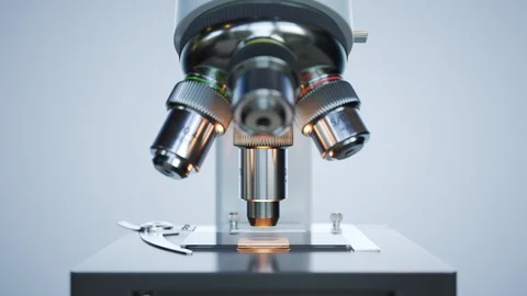 "A modern microscope in a sterile laboratory room analyzing cell samples. 4KHD" 動画素材 98944829