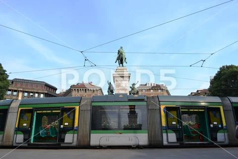 Modern Milan tram parked in Cairoli square. Stock Photos