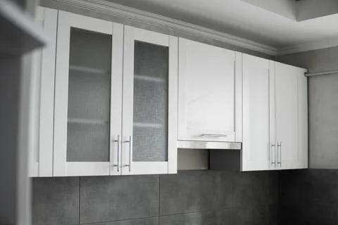 Modern minimalism style kitchen interior in monochrome tones. Custom kitchen Stock Photos
