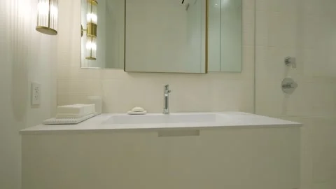 A Modern Minimalist Bathroom designed with Elegant Fixtures for a refined living Stock Footage 285795246