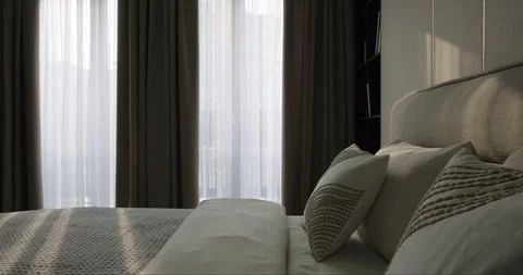 Modern minimalist bedroom interior design with bed pillows open cabinet wall Stock Footage 277611247