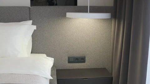 Modern minimalist bedroom with large bed and natural daylight. Stock Footage 330003071