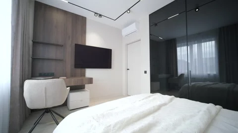 Modern minimalist bedroom with large bed and natural daylight. Stock Footage 330003673