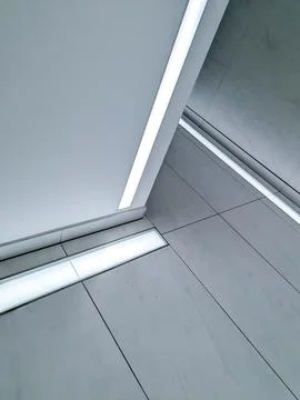 Modern Minimalist Interior with LED Light Lines and Geometric Architecture Stock Photos