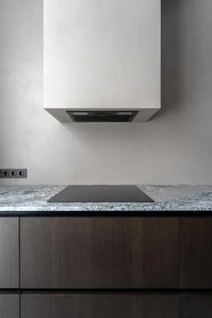 Modern minimalist kitchen with built in extractor hood 库存照片