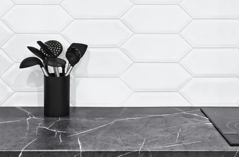 Modern minimalist kitchen interior featuring a sleek white marble counterto.. Stock Photos