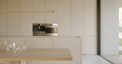 Modern Minimalist Kitchen with Natural Light and Sleek Design Stock Footage 344271672