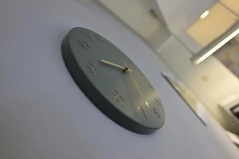 Modern Minimalist Wall Clock in Muted Green Stock Photos