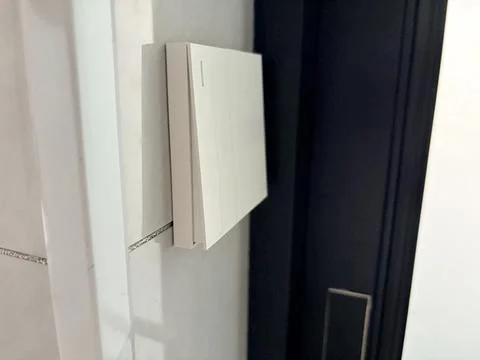 Modern Minimalist Wall Light Switch in a Contemporary Interior Stock-Fotos