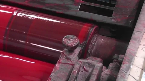 Modern mixing process red ink roller in the fountains four color printing press. Stock Footage 85247598