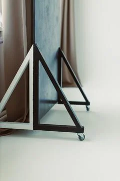 This modern mobile display stand features an eyecatching triangular base desi Stock Photos