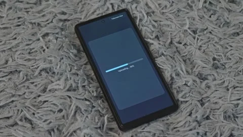 Modern mobile phone screen showing progress bar uploading data concept of high Stock Footage 341569442