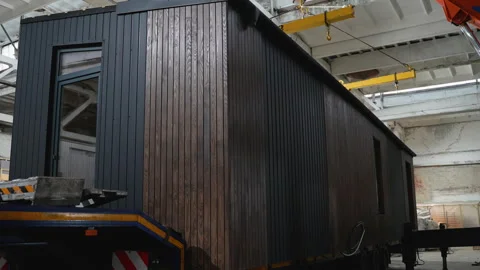 Modern modular home being loaded onto transport truck Stock Footage 301824159