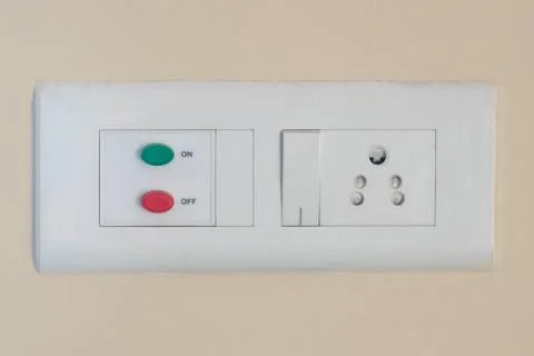 Modern modular switchboard with on/off switch, 3 pin socket and fan regulator Stock Photos