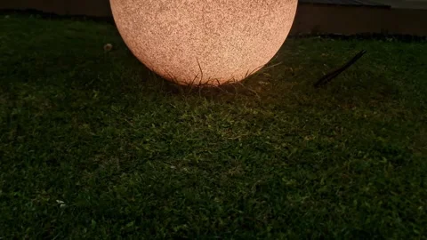 Modern Moon Globe Garden Light Glowing in Park at Night with Warm Ambient Stock Footage 332923964