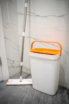 Modern mop with bucket with two sections. Mop with spin and rinse Stock Photos