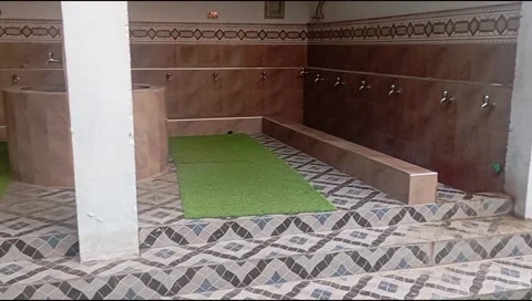 Modern mosque wudu ablution area with taps empty no people Stock Footage 345554078