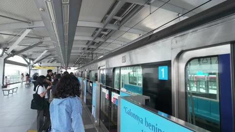 Modern MRT Train Arriving At Station Platform With Waiting Passengers Video stock 338387897