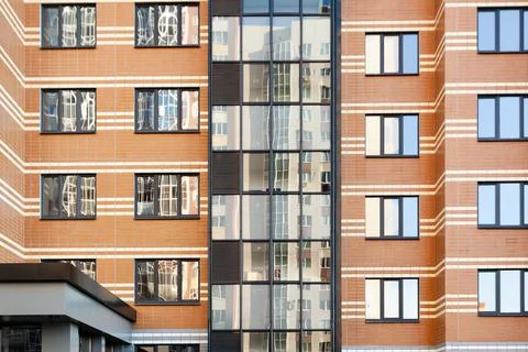 Modern multi-apartment multi-storey residential building with apartments Stock Photos